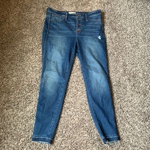 Madewell distressed skinny jeans.